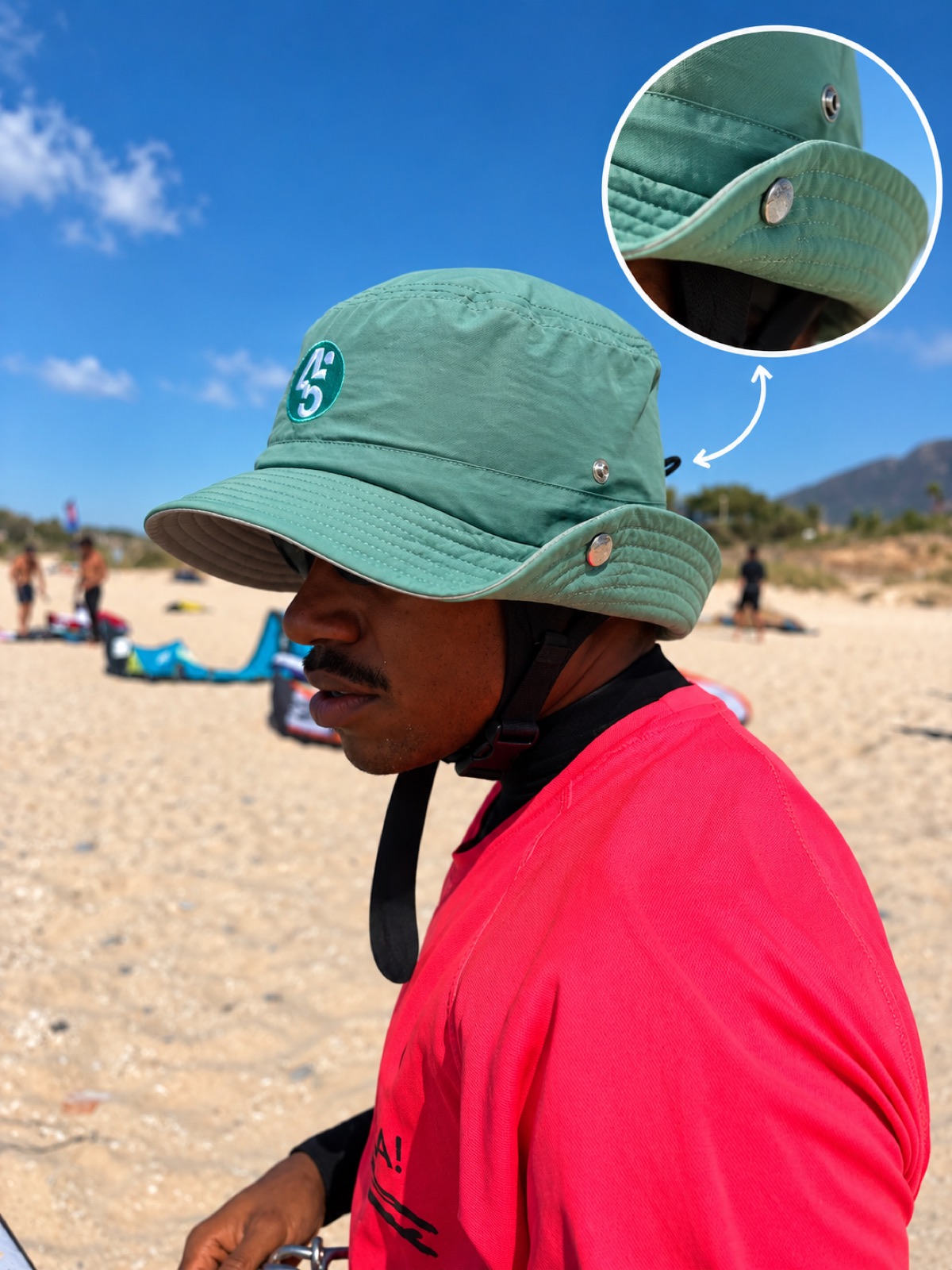 Kitesurfer wearing the Surf Safe helmet hat at the beach, with a close-up of the chin strap buckle